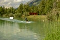 Man practicing wakeboard on the lake at Tasch in the Swiss alps