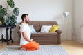 Man practicing yoga and meditation at home. A series of yoga poses. Lifestyle concept Royalty Free Stock Photo