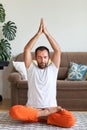 Man practicing yoga and meditation at home. A series of yoga poses. Lifestyle concept Royalty Free Stock Photo