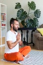 Man practicing yoga and meditation at home. A series of yoga poses. Lifestyle concept Royalty Free Stock Photo