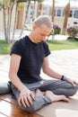Man practicing yoga outdoors
