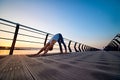 Man practicing yoga at sunset and doing dog face down Royalty Free Stock Photo