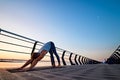 Man practicing yoga at sunset and doing dog face down Royalty Free Stock Photo