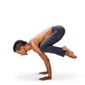 Man practicing youga crow pose bakasana