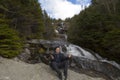 Man in praise looking out from elevation on Mount Washinton via Royalty Free Stock Photo