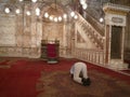 Man praying in Citadela in Cairo, Egypt