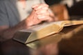 Man praying hands on a Bible Royalty Free Stock Photo