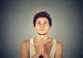 Man praying hands clasped hoping for best asking for forgiveness Royalty Free Stock Photo