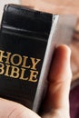 Man Praying Holding the Bible Royalty Free Stock Photo