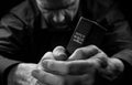 A Man praying holding a Bible. Royalty Free Stock Photo