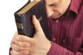 Man Praying Holding the Bible Royalty Free Stock Photo