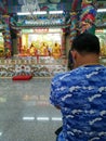 Man pray for lucky at Chinese shrine, Thailand