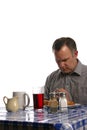 Man praying before meal in diner