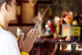 Man praying for new year ,lighting incense to Buddha. Royalty Free Stock Photo