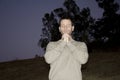 Man praying in a park Royalty Free Stock Photo