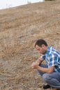 Man praying on the side of a hill.