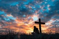 Man Praying Silhouetted by Sunset at Hilltop Cross