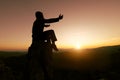 Man praying at sunset mountains raised hands Travel Lifestyle spiritual relaxation emotional concept, Freedom and travel adventure Royalty Free Stock Photo