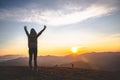 Man praying at sunset mountains raised hands Travel Lifestyle spiritual relaxation emotional concept, Freedom and travel adventure Royalty Free Stock Photo