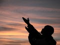 Man praying to god with arms outstretched stock photo Royalty Free Stock Photo