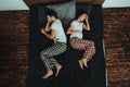 Man and Pregnant Woman Feeling Headache on Bed