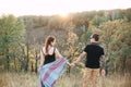 Man and pregnant woman hugging holding hands on the background of wild nature, autumn. love story Royalty Free Stock Photo