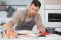 Man preparaing pizza at home Royalty Free Stock Photo
