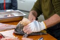 Man prepare a fresh fish by gutting and filleting. Royalty Free Stock Photo