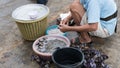 Man prepare shellfish for sale in the local market