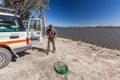 Man prepared himself for catching Yabbies with an Opera House net  on the banks of a drainage channel along lake Bonney Royalty Free Stock Photo