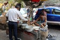 Man prepares simple street food in Kolkata