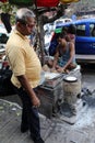 Man prepares simple street food in Kolkata