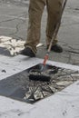 Man Prepares Woodblock for Printing