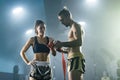 Man preparing bandages for woman Muay Thai boxer getting ready for fight Royalty Free Stock Photo