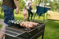 A man is preparing a barbecue in the yard for the whole family Royalty Free Stock Photo