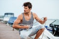 Man preparing boat to start a journe at the pier Royalty Free Stock Photo