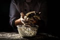 Man preparing bread dough on wooden table in a bakery close up. Preparation of Easter bread.Men hands Royalty Free Stock Photo