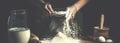 Man preparing bread dough on wooden table in a bakery close up. Preparation of Easter bread. Royalty Free Stock Photo