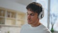 Man preparing breakfast earphones dancing on kitchen close up. Guy singing song Royalty Free Stock Photo