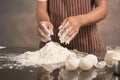 Man preparing buns at table in bakery. Royalty Free Stock Photo