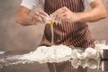 Man preparing buns at table in bakery. Royalty Free Stock Photo