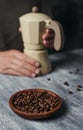 Man is preparing coffee in a beige moka pot Royalty Free Stock Photo