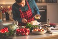 Man preparing delicious and healthy food in the home kitchen for christmas Christmas Duck or Goose Royalty Free Stock Photo