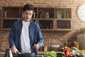 Man preparing delicious and healthy food in the home kitchen Royalty Free Stock Photo