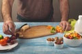 Man preparing a fruit salad with yogurt Royalty Free Stock Photo