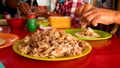 man preparing his traditional mexican carnitas taco from Michocan