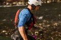 Man preparing for kayak tour on a mountain river Royalty Free Stock Photo