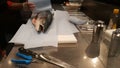 Man preparing a salmon to make sushi in a fish market Royalty Free Stock Photo