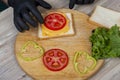 man preparing sandwiches