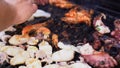 Man preparing seafood on the barbecue grill